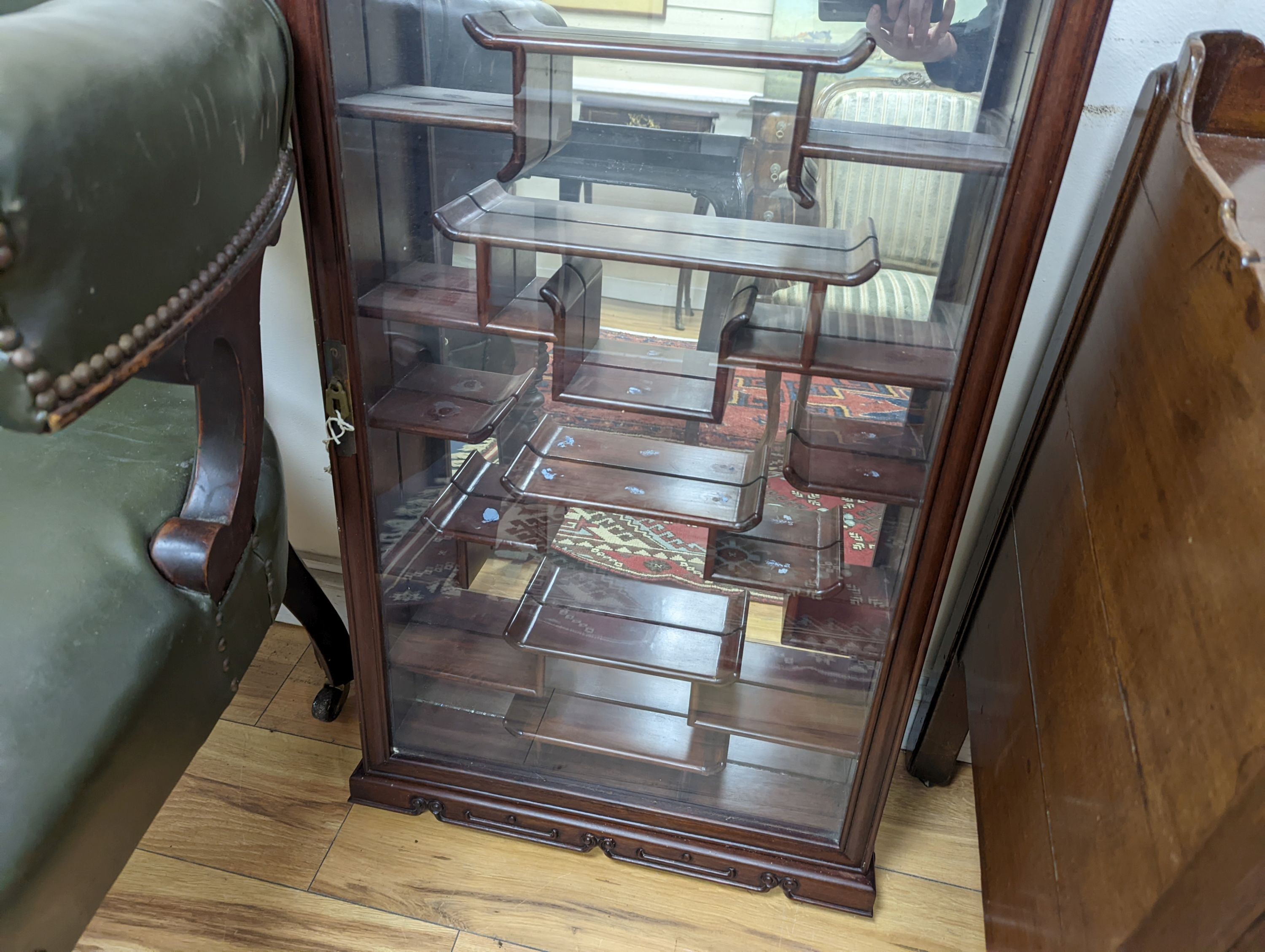 A Chinese glazed hardwood wall display cabinet, width 50cm, height 85cm